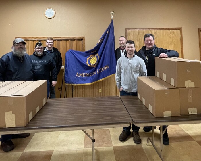 Clow Valve presents American Legion Post 34 with food donation and care package